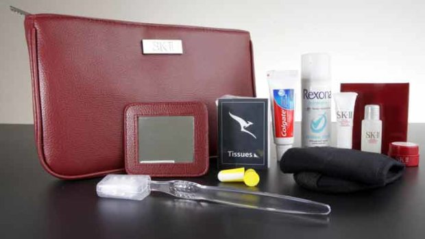 Qantas's first class women's offering includes SK-II cosmetics in a snazzy red bag.
