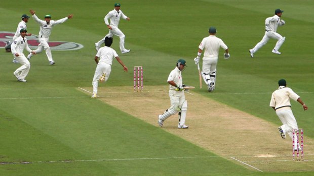 Punted ... Pakistan players celebrate as Mohammad Sami, fourth from left, sets up a potential hat-trick with Australian captain Ricky Ponting's wicket at the SCG yesterday.
