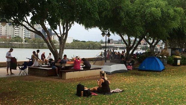 Crowds gather at the South Bank Parklands early on New Year's Eve in order to secure a place to watch the fireworks.