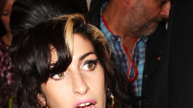 Plastic surgery disaster ... Amy Winehouse hospitalised for leaky breast implants.