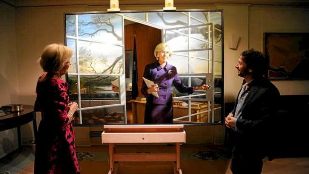From both sides: Quentin Bryce views the official portrait of her by artist Ralph Heimans.