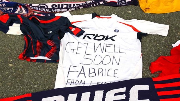 Tributes and get-well messages for Fabrice Muamba outside the Reebok Stadium in Bolton.