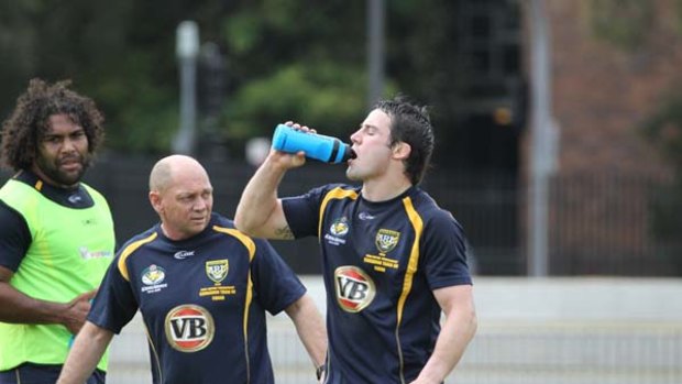 Star half ... Cooper Cronk trains at Redfern Oval yesterday.
