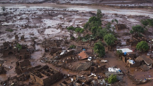 Homes lay in ruins after two dams burst on Thursday, flooding the small town of Bento Rodrigues, Brazil. 