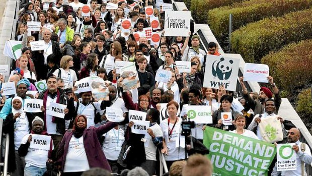 Members of NGOs walk out of the UN Climate Change Conference in Warsaw, claiming the talks are 'on track to deliver virtually nothing.'