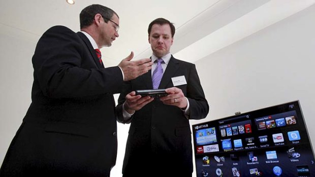 Hiked tech prices for Australia ... federal MP Ed Husic, right, with Senator Stephen Conroy. 