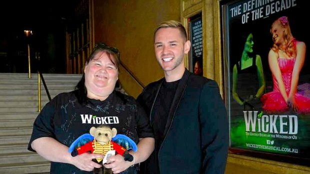 <i>Wicked</i> fan Joann Pettiford with performer Ryan Sheppard.