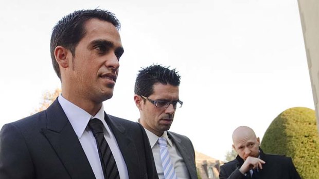 Three-time Tour de France champion Alberto Contador (L) arrives flanked by his brother Fran (C) and his laywer Mike Morgan at his hearing at the Court of Arbitration for Sports in Lausanne.