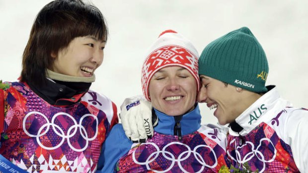 The Olympic spirit ... Women's freestyle skiing aerials gold medalist Alla Tsuper of Belarus, centre, celebrates with silver medalist Xu Mengtao of China, left, and bronze medalist Lydia Lassila of Australia.