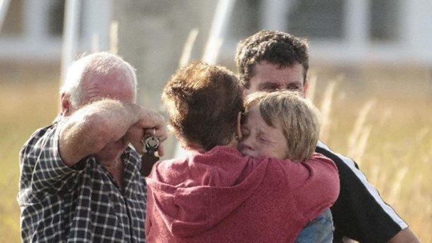 Friends and family members at the scene of the fatal hot air balloon crash in Carterton, New Zealand.