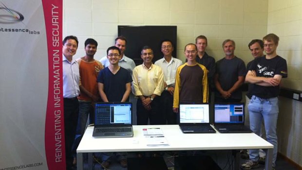 Vikram Sharma, fourth from left, leads the team that built a quantum key device to be tried out at NASA's research facilities in California.