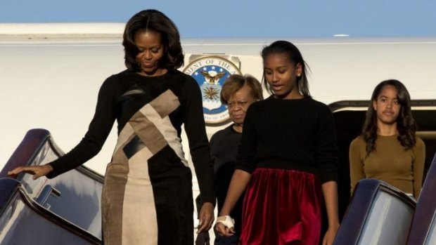 White House women: Michelle Obama arrives in Beijing with her mother Marian Robinson and daughters Sasha and Malia.