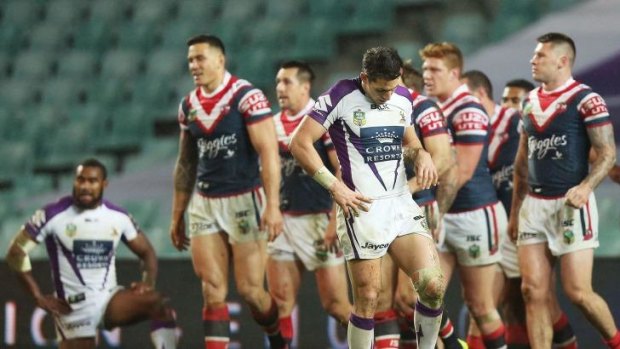 Let down: Storm captain Billy Slater feels the pain of another Roosters try.