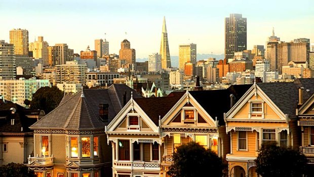 Victorian houses set against San Francisco's skyline.