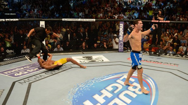 Chris Weidman celebrates after knocking out Anderson Silva to win the UFC middleweight title.