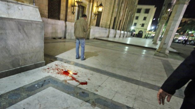 Blood is seen on the ground after a bomb blast in Cairo.