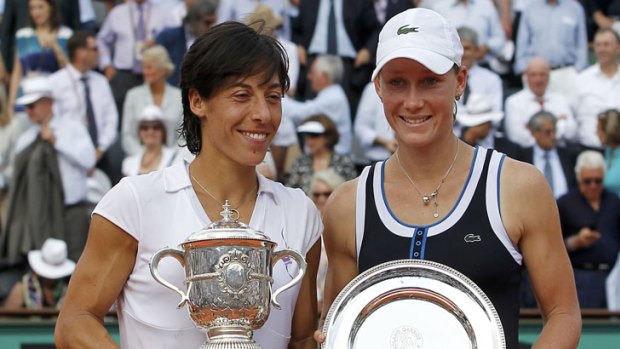 Francesca Schiavone of Italy (left) poses with Stosur during the trophy ceremony after winning the women's final at the French Open.