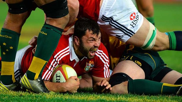 Marching on: Alex Corbisiero scores for the Lions in their commanding victory over the Wallabies at ANZ Stadium.