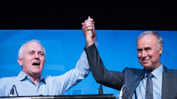 John Alexander (right) and Prime Minister Malcolm Turnbull celebrate at Ryde-Eastwood Leagues Club on Saturday, December 16, after Mr Alexander's byelection victory.