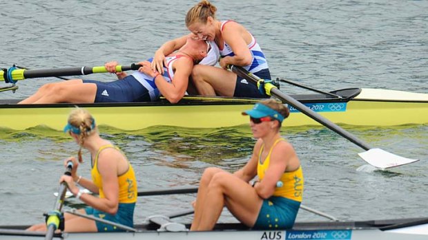 Opening their account ... Heather Stanning and Helen Glover celebrate after winning gold as the Australian pair of Sarah Tait and Kate Hornsey look on.