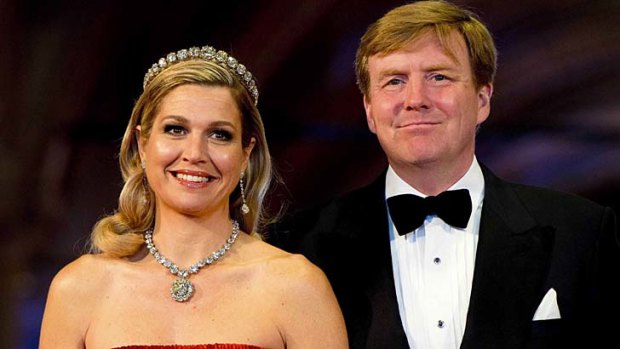 Dutch Crown Prince Willem-Alexander and his wife, Crown Princess Maxima, arrive at a gala dinner organised on the eve of the abdication of Queen Beatrix.