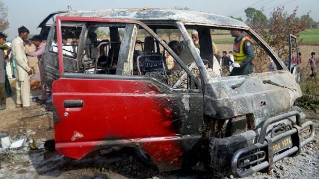 Fatal: The charred wreckage of a school van.