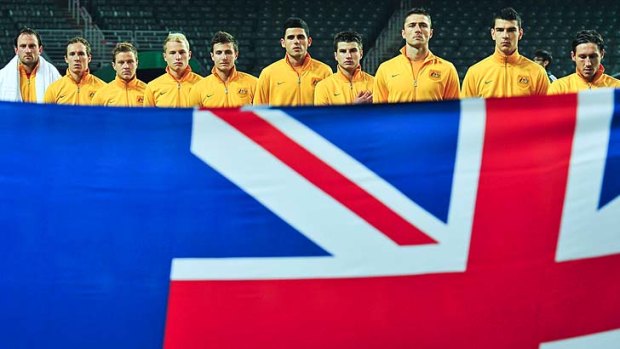 Vital &#8230; the Socceroos line up for the national anthem before Thursday's game against Guam. Australia hammered the US territory 9-0.