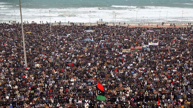 Mass appeal ... Libyans pray while demonstrating for the removal of Muammar Gaddafi in Benghazi.