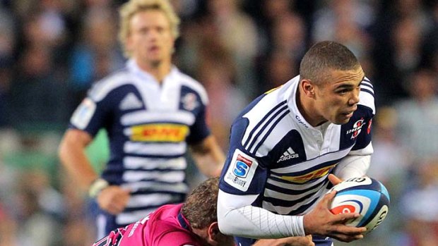 Bryan Habana of the Stormer is tackled.