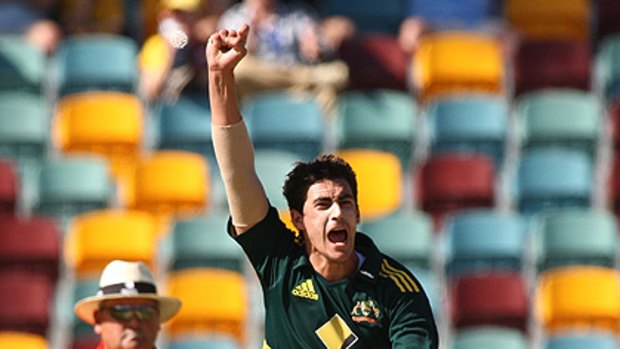 The empty seats at the Gabba can be seen behind Mitchell Starc as he celebrates during the match between Australia and Sri Lanka yesterday.