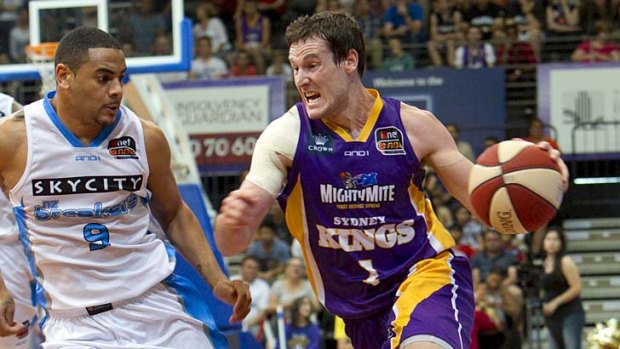 On top  ...  the Sydney Kings in action against the New Zealand Breakers on Saturday.