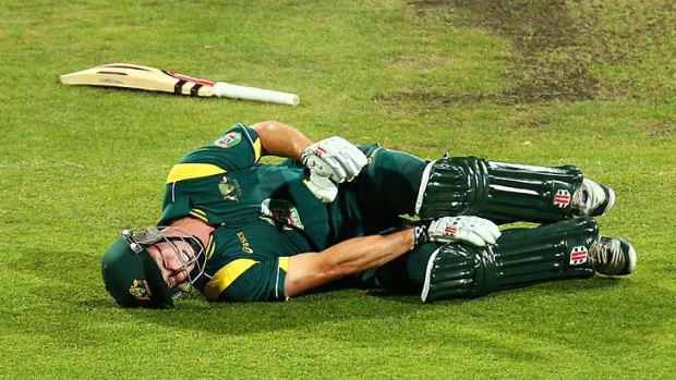 Down, but not out ... Shaun Marsh of Australia A falls to the ground and clutches his right knee.