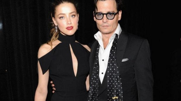Amber Heard with fiance Johnny Depp in May this year. 