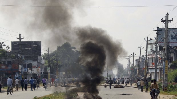 Smoke from burning tyres in the town of Birgunj on the border with India.