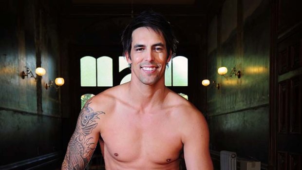 Injured fast bowler Mitchell Johnson takes a break from a modelling shoot in Kew yesterday.