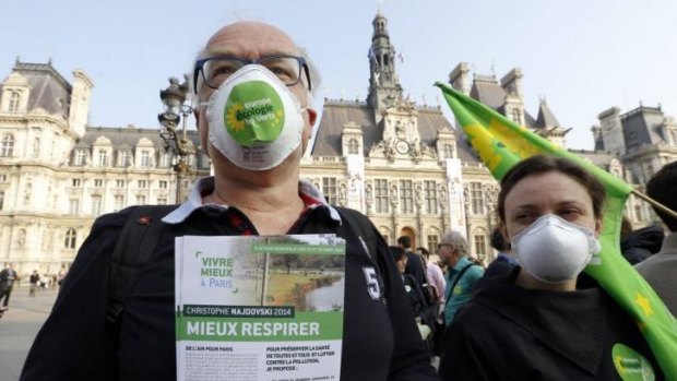 A demonstration against pollution in front of the city hall building in Paris.