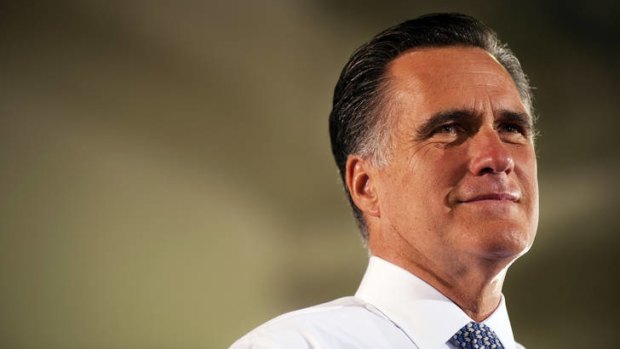 Under fire ... Mitt Romney.