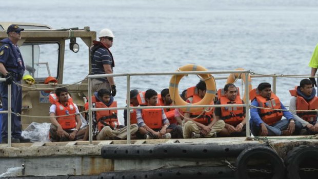 Asylum seekers arrive on Christmas Island after Indonesia refused to allow them to return.