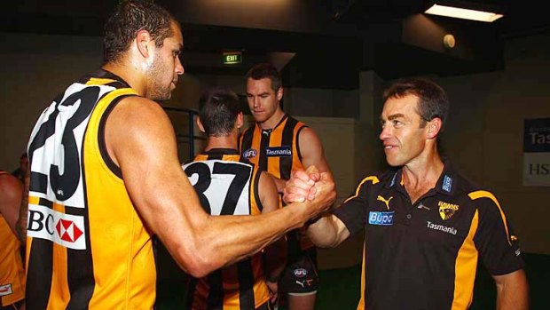 Well done: Lance Franklin is congratulated on his six-goal game by coach Alastair Clarkson.