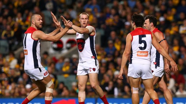 Max Gawn and Tom McDonald celebrate a goal against the Eagles.