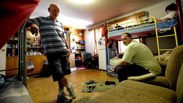 Residents Mark Towler and Geoff Packer in their room at the "cesspool" rooming house in Glen Iris.