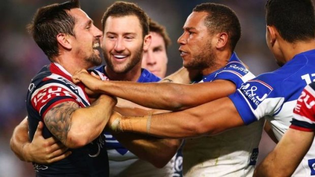 Fight night: Mitchell Pearce and Moses Mybe get physical on Friday night.