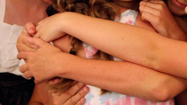 A school hugging ban has annoyed a Bunbury mother, whose daughter copped a detention.