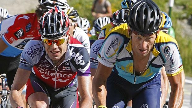 Tough competition: Cadel Evans (left) cycles beside Lance Armstrong during the seventh stage of the 2009 Tour de France.