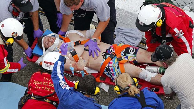 Aftermath ... rescue workers attend to the injured in the stands following a last-lap incident during the NASCAR Nationwide Series.