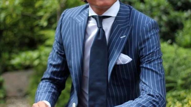 A pin stripe suit in blue make a strong corporate statement.