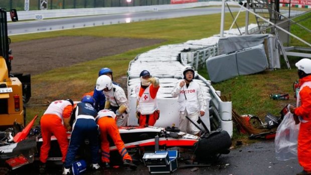 Jules Bianchi receives urgent medical treatment after colliding with a recovery vehicle during the Japanese Formula One Grand Prix.