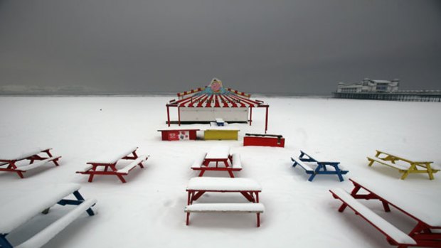 The beach at Weston-Super-Mare in England is covered by a fresh snowfall on Tuesday.