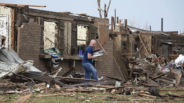 A Oklahoma man salvages his belongings.