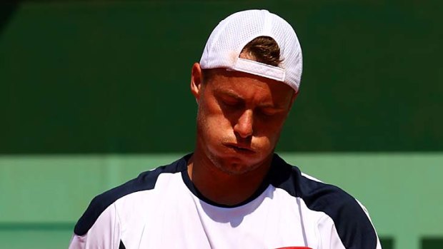 Lleyton Hewitt reacts after losing a point.